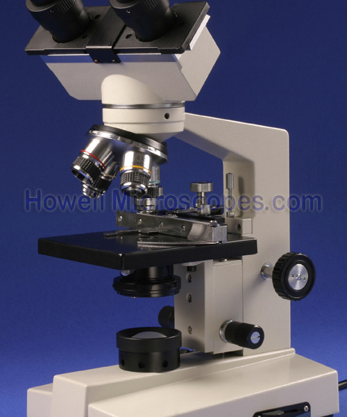 Compound light microscope for use with viewing biological specimens on slides.